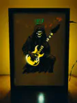 Rockstar Skeleton – Shadow Box Frame with LED Glow | Guitarist Skull Art for Music Lovers